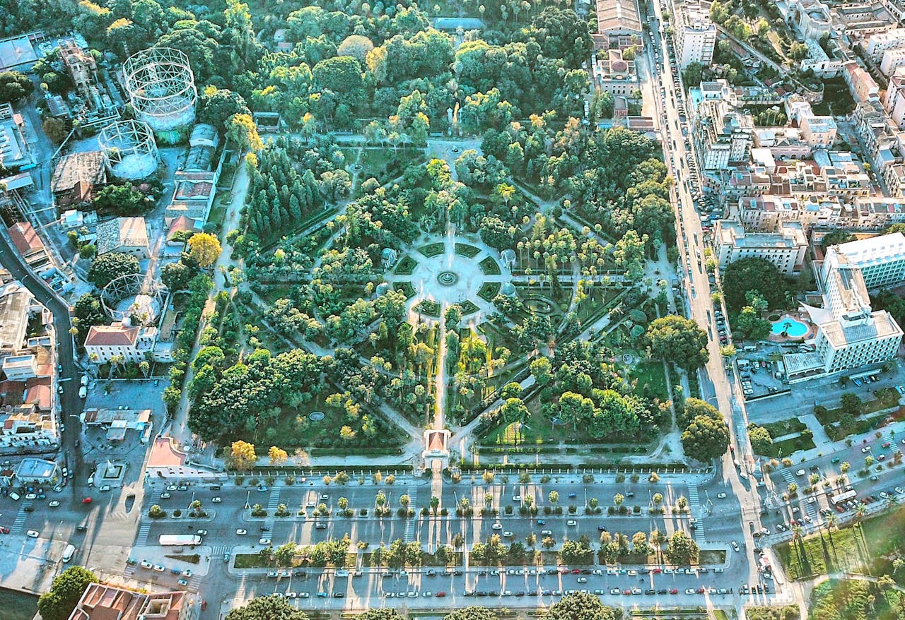 gallery-3 Stunning aerial shot of a lush urban park in downtown Palermo, Sicily, showcasing vibrant greenery and cityscapes.